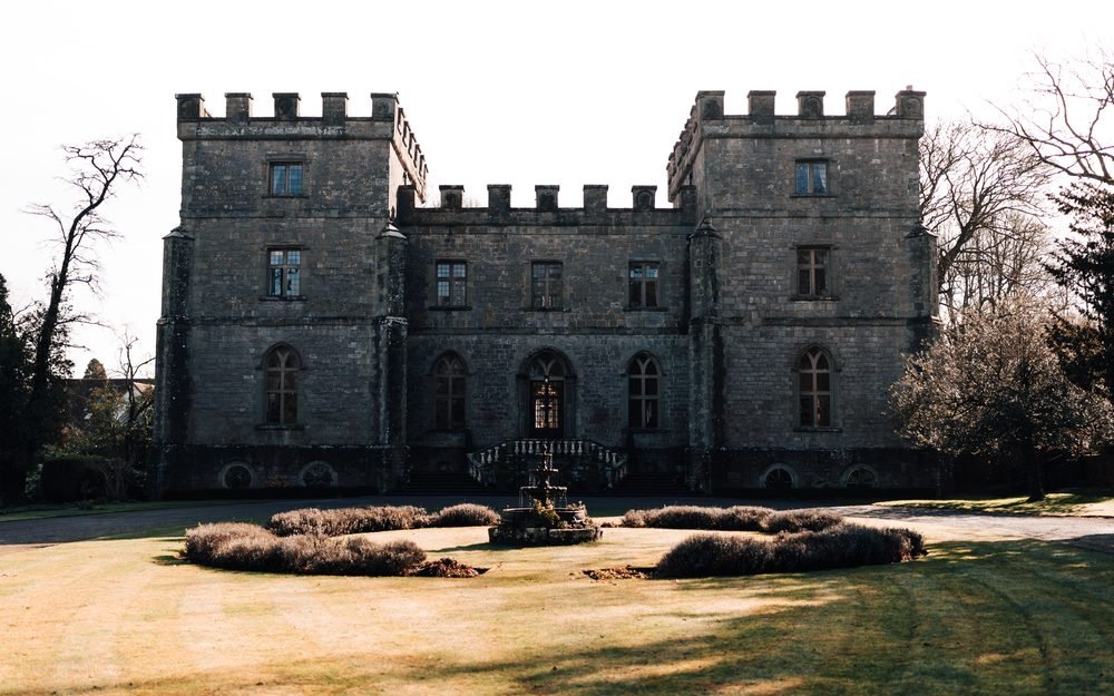 The front of Clearwell Castle on a clear day