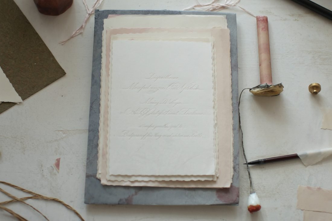 Letterpress invitations with sealing wax, a brass seal and a calligraphy nib